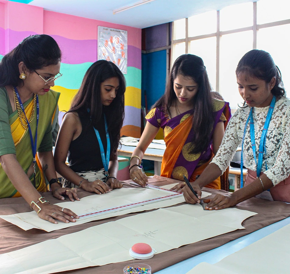 Picture of Expert Faculty Teaching Fashion Designing Techniques to Students